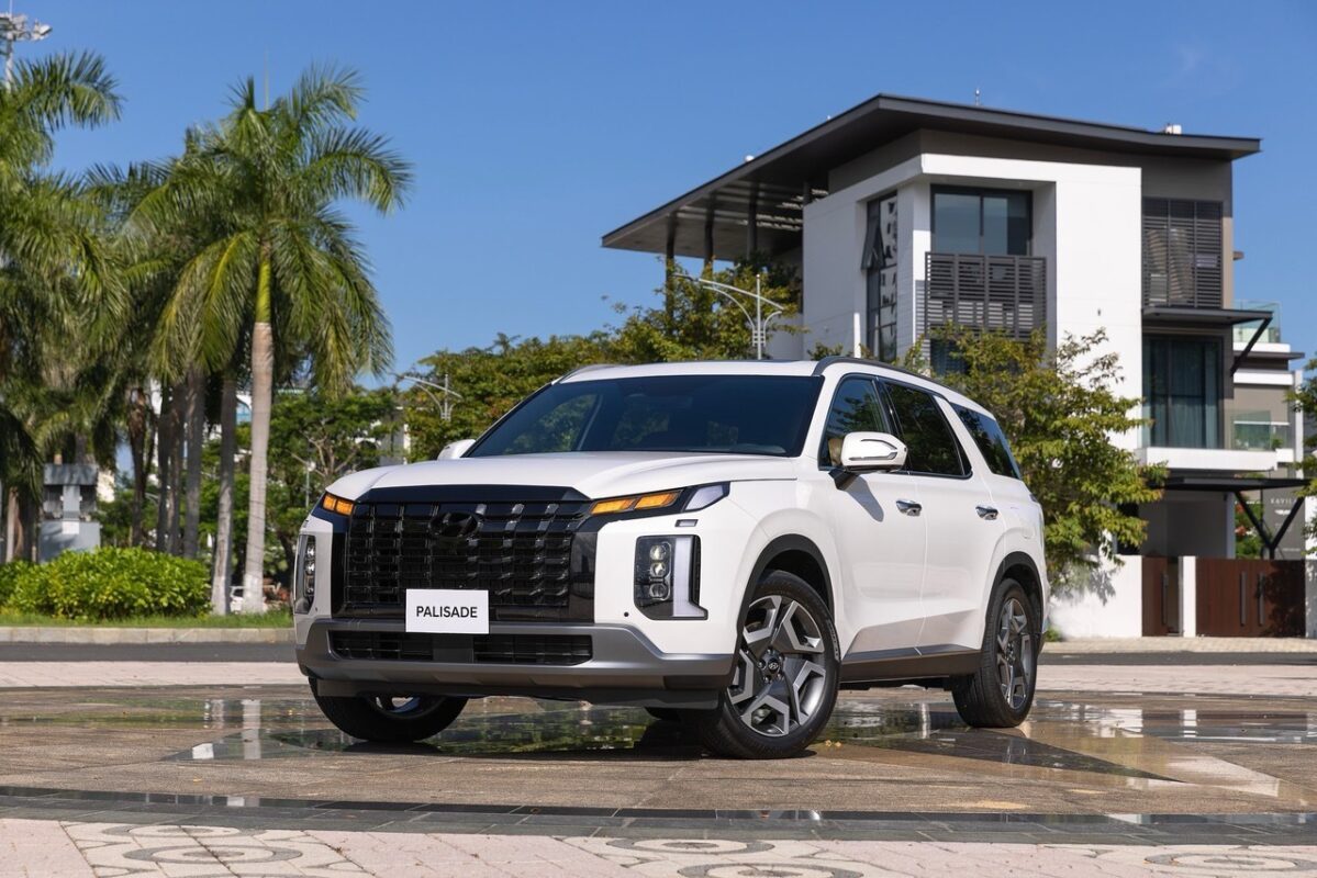 a white car parked in front of a building